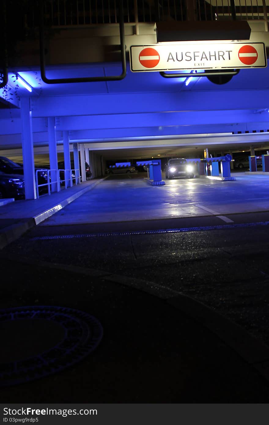 Parking garage with bright neon lights at night