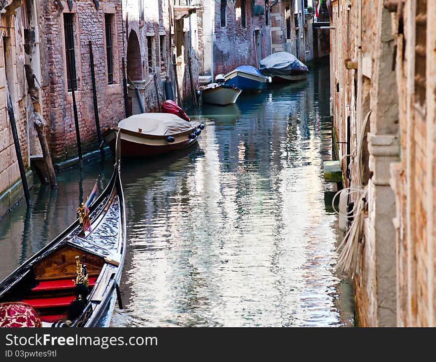 Canal, gondola, boats in Venice, Italy