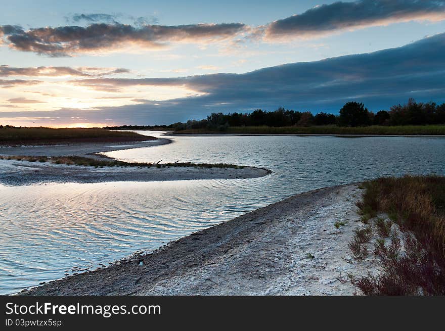 Fresh atmosphere of the sunrise over a sea lake. Fresh atmosphere of the sunrise over a sea lake