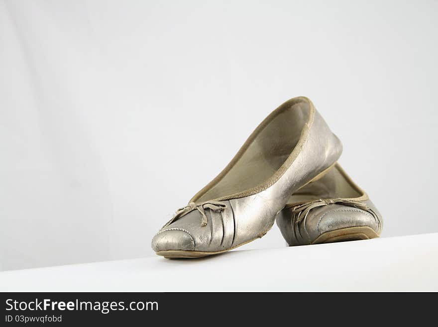 Neutral coloured ballet flats on white background. Neutral coloured ballet flats on white background