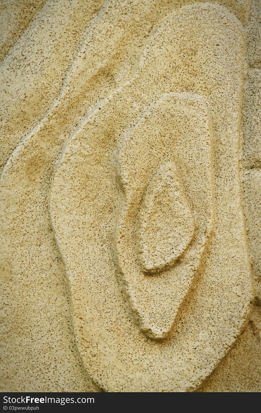 Asian style cloud pattern on a stone wall