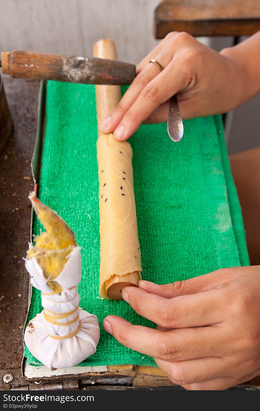 Woman hands making thai dessert, coconut sticks. Woman hands making thai dessert, coconut sticks