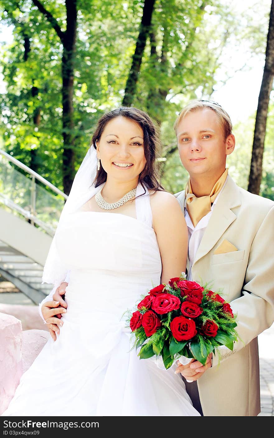 Portrait of bride and groom smiling outdoor