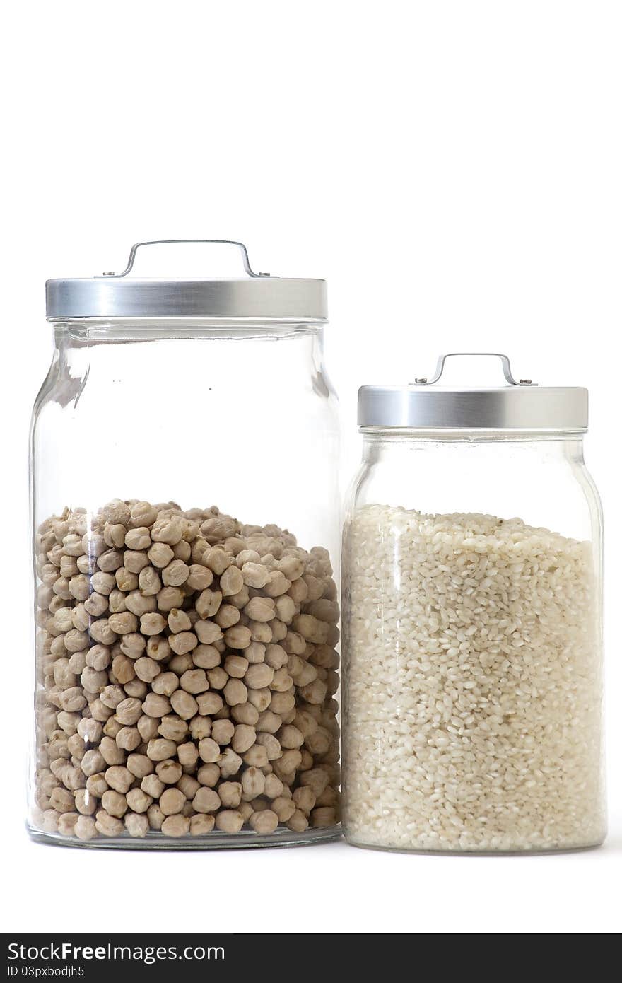 A pair of glass jar with rice and chickpeas