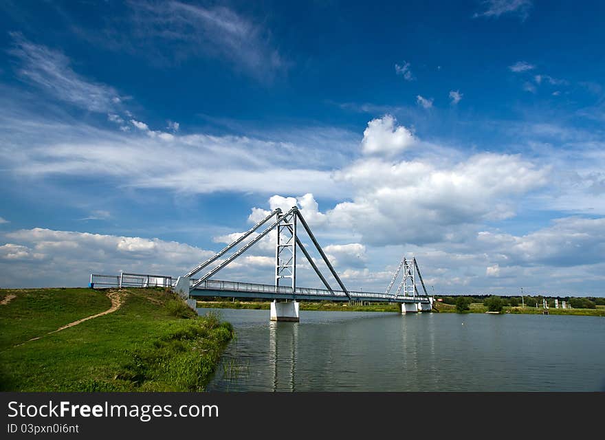 Modern steel bridge over the river