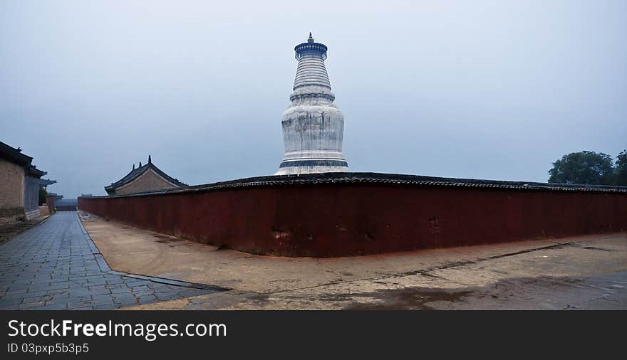 The chinese tower in front of a temple, this tower has already had a history of a thousand years.