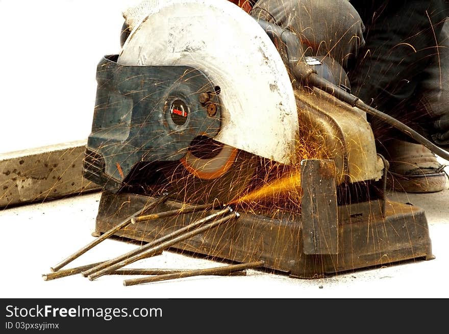 Worker cutting steel with high speed wheel