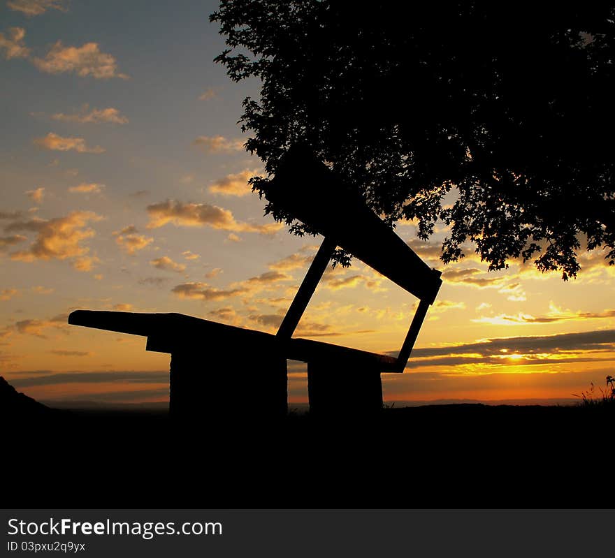 Alone bench in the sunset