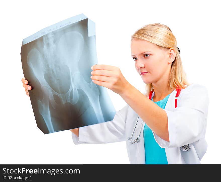 Young doctor examining an x-ray image of the pelvis