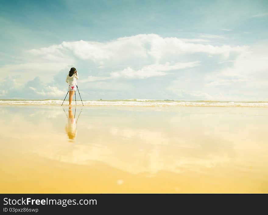 Female photographer in Heaven, where the sky meets the land, blue sky, great landscape,. Female photographer in Heaven, where the sky meets the land, blue sky, great landscape,