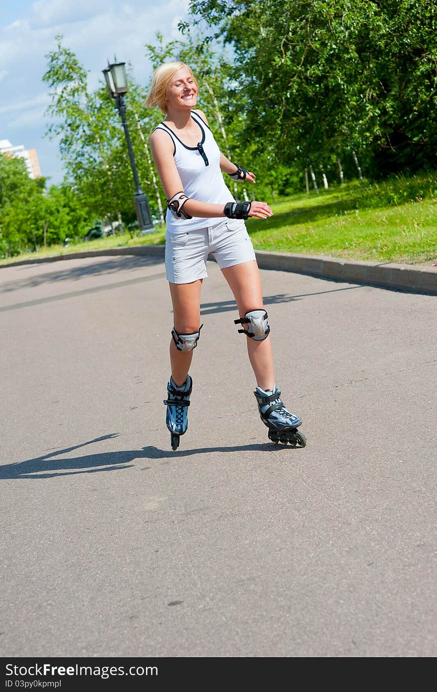 Girl roller-skating in the park