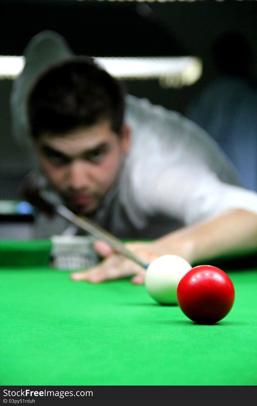 Snooker Player Face Blurred While Playing Shot. Snooker Player Face Blurred While Playing Shot.