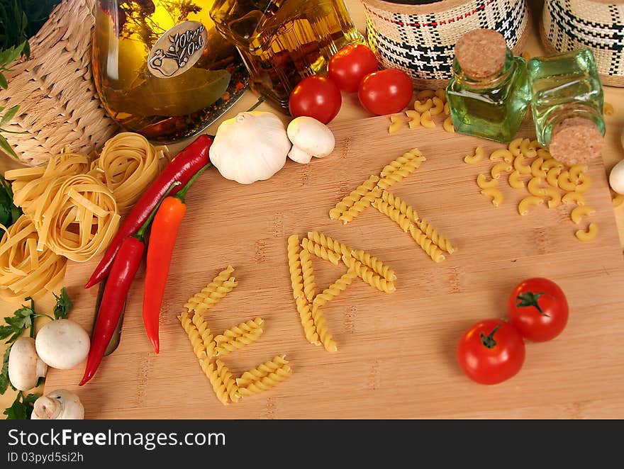 Fresh vegetables, macaroni and olive oil on table. Fresh vegetables, macaroni and olive oil on table