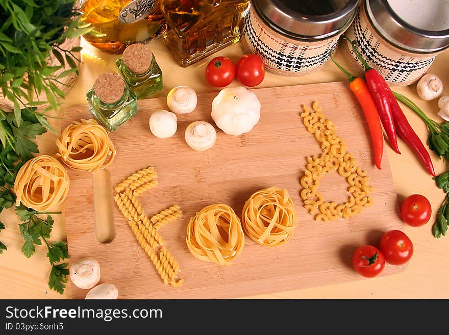 Fresh vegetables, macaroni and olive oil on table. Fresh vegetables, macaroni and olive oil on table