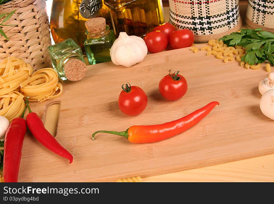 Fresh vegetables, macaroni and olive oil on table. Fresh vegetables, macaroni and olive oil on table