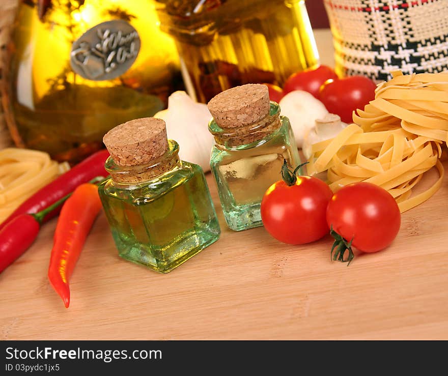 Fresh vegetables, macaroni and olive oil on table. Fresh vegetables, macaroni and olive oil on table