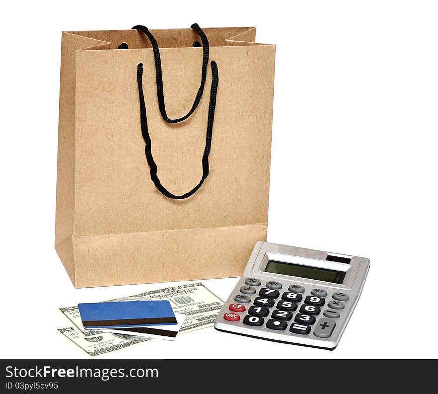 Shopping bag, plastic card, calculator and cash - shopping concept