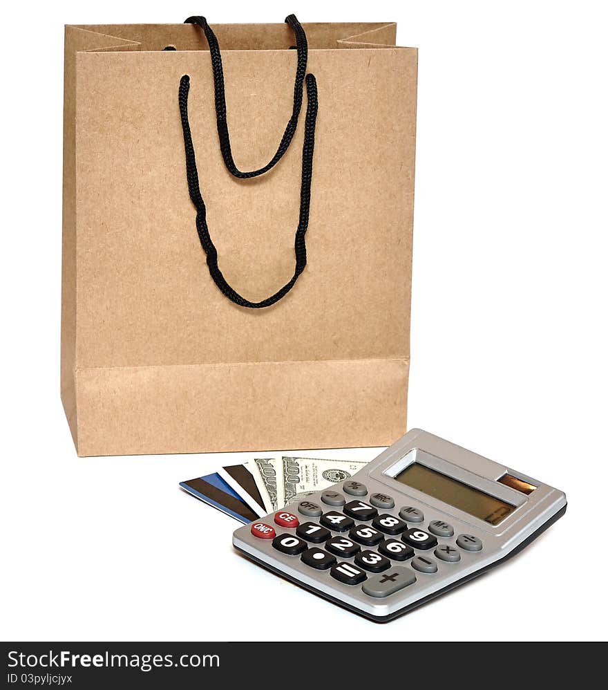 Shopping bag, plastic card, calculator and cash - shopping concept