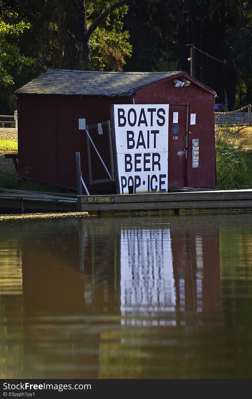 Red boathouse and dock on the lake