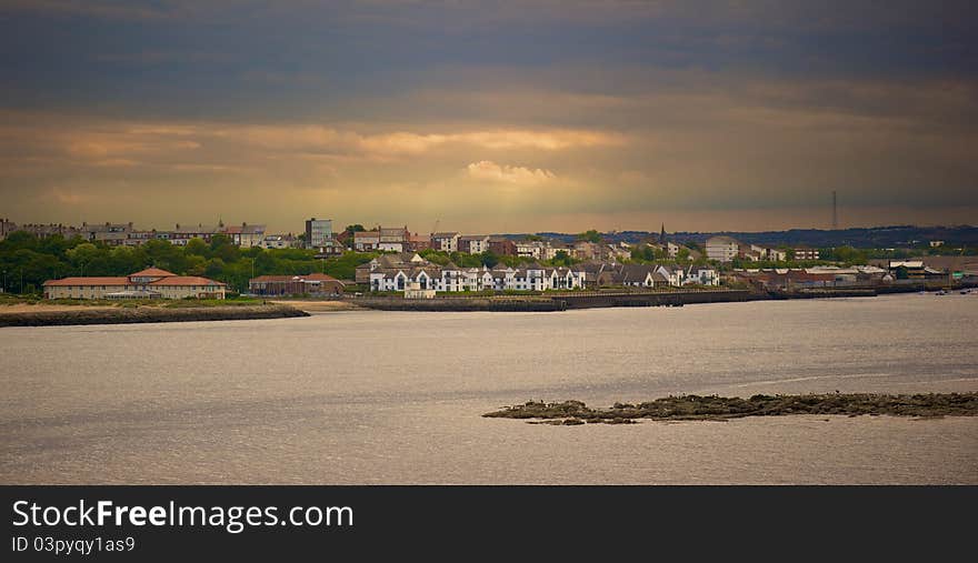 View across river Tyne to South Shields.  Black Middens (Rocks) in the foreground. View across river Tyne to South Shields.  Black Middens (Rocks) in the foreground