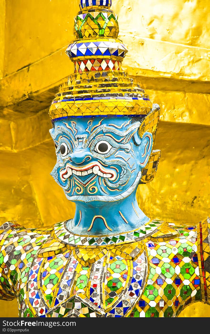 Face to giant thai on gold background