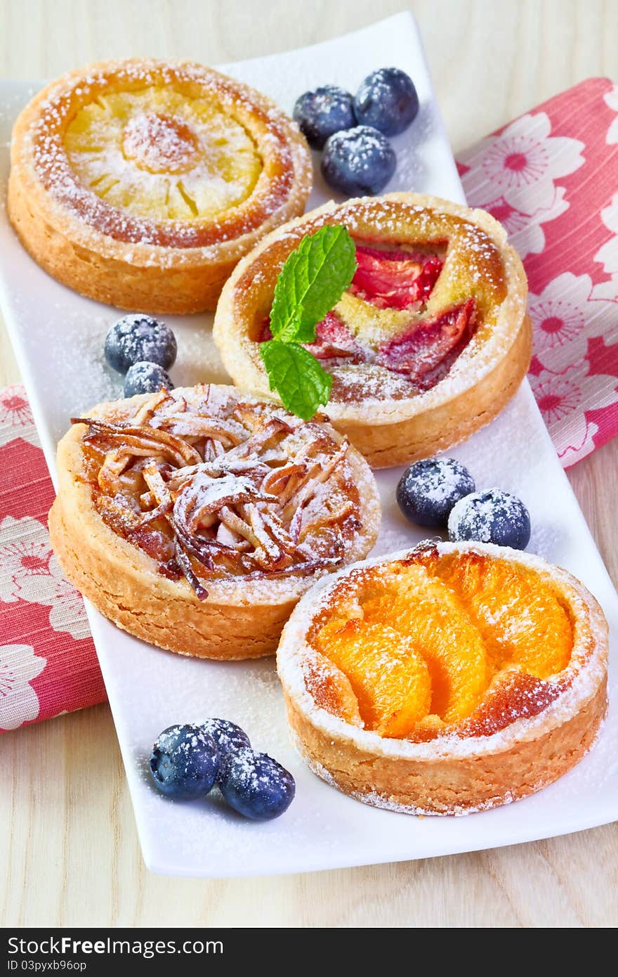 4 different fruit cake on white plate. 4 different fruit cake on white plate.