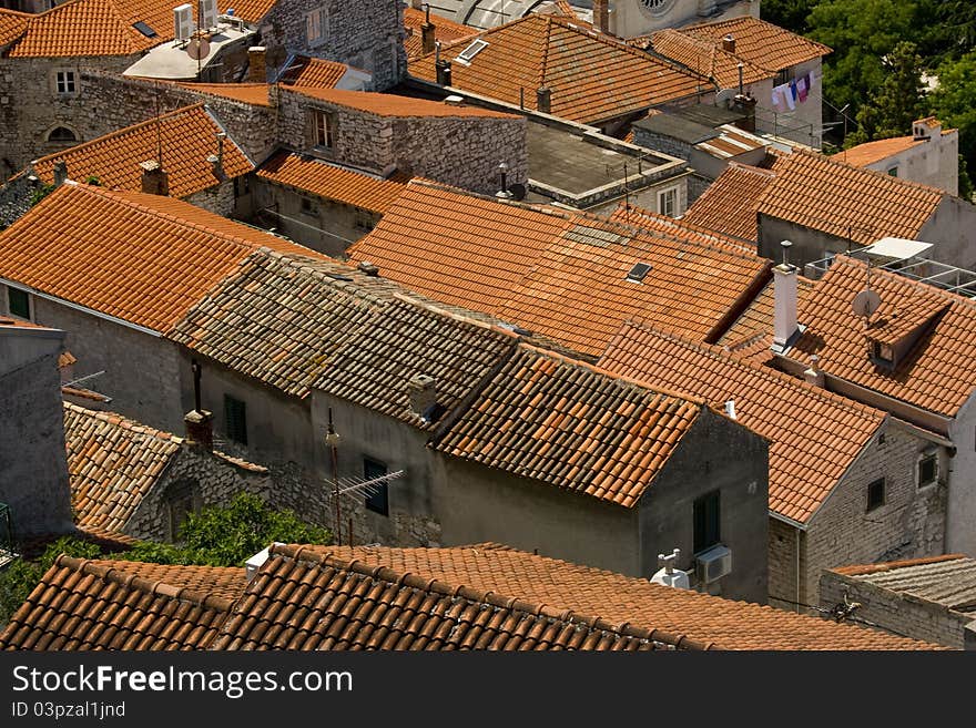 Panoramic view on the red roof tiles of stone houses in old part of Sibenik. Panoramic view on the red roof tiles of stone houses in old part of Sibenik