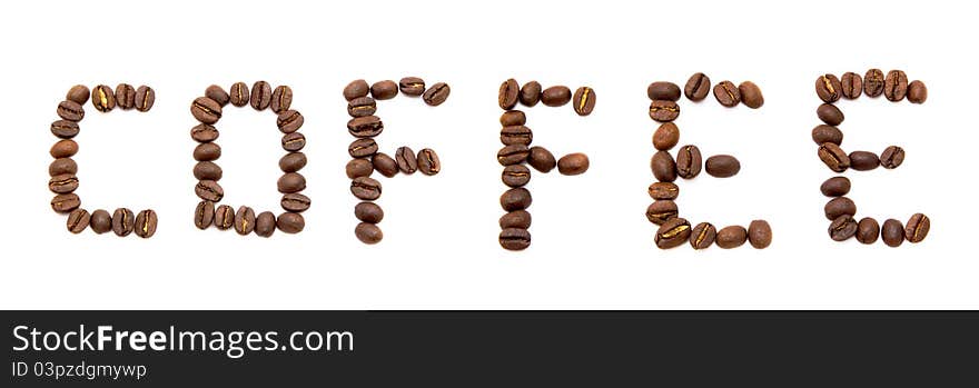 Word coffee spelled with fried coffee beans isolated on white