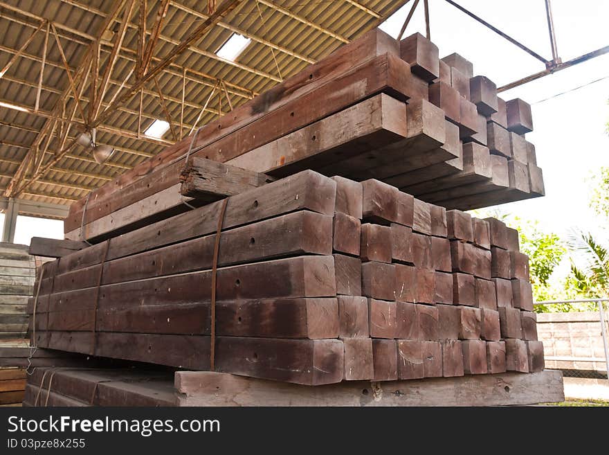 Pile of wood girder stacked in group in stockpile