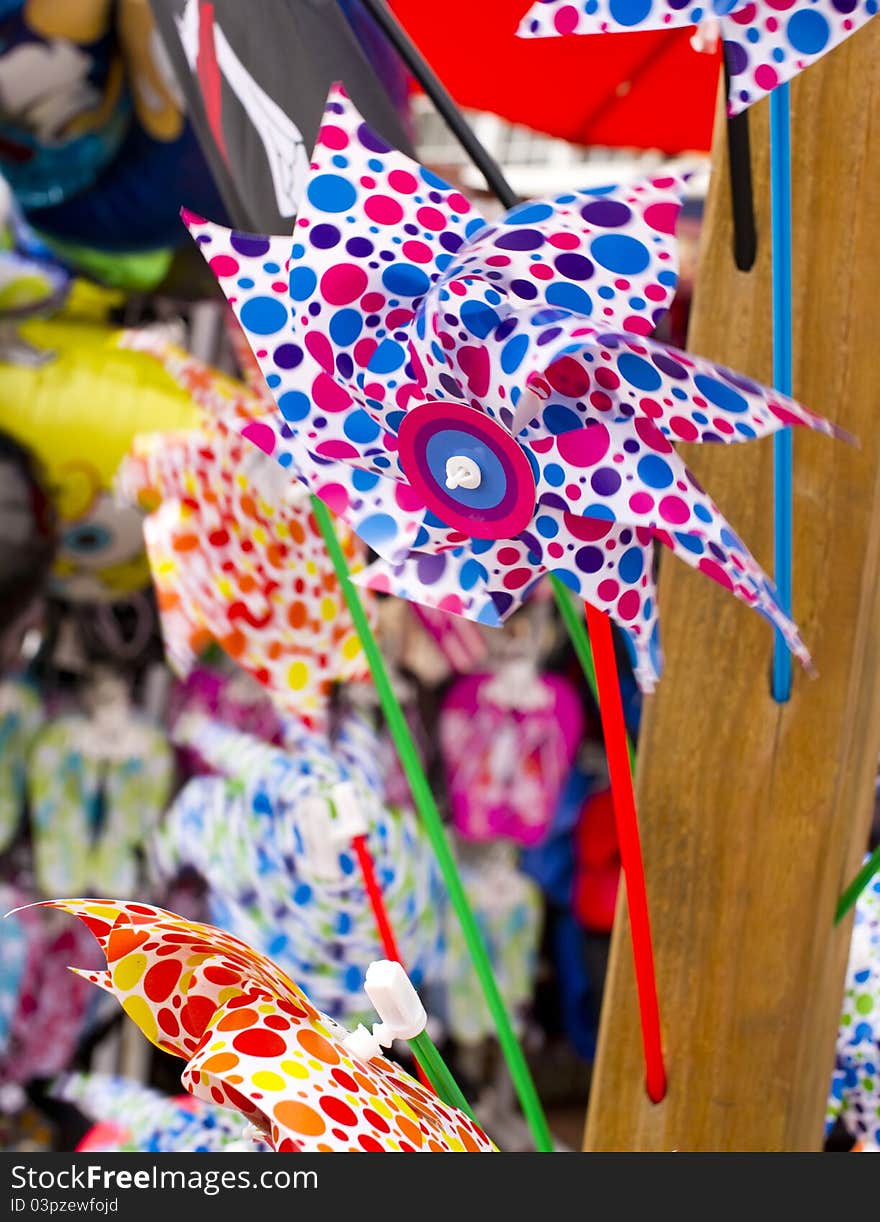 Colourful rotating pinwheel. Souvenir market