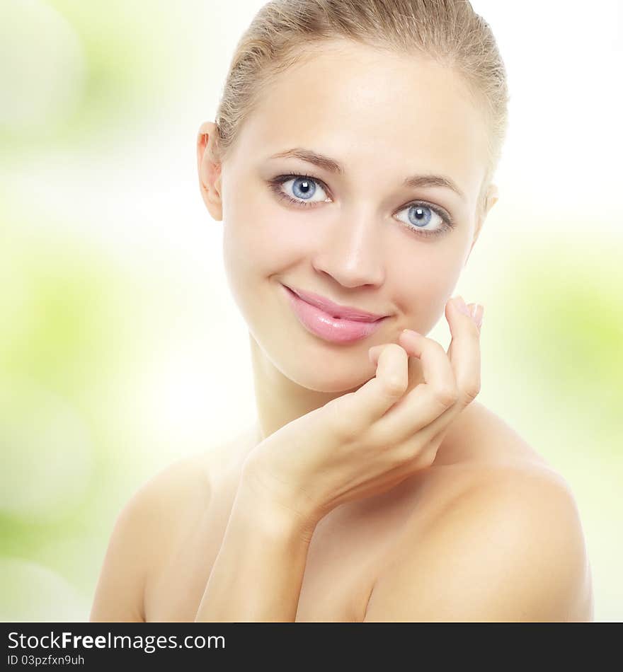 Young healthy woman on a light background