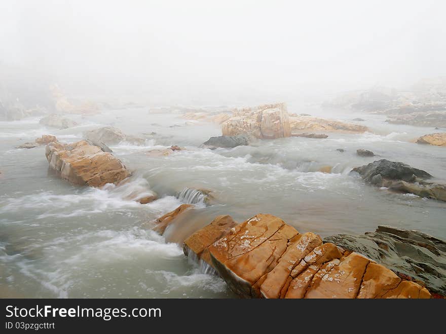 Fog in winter over the stream