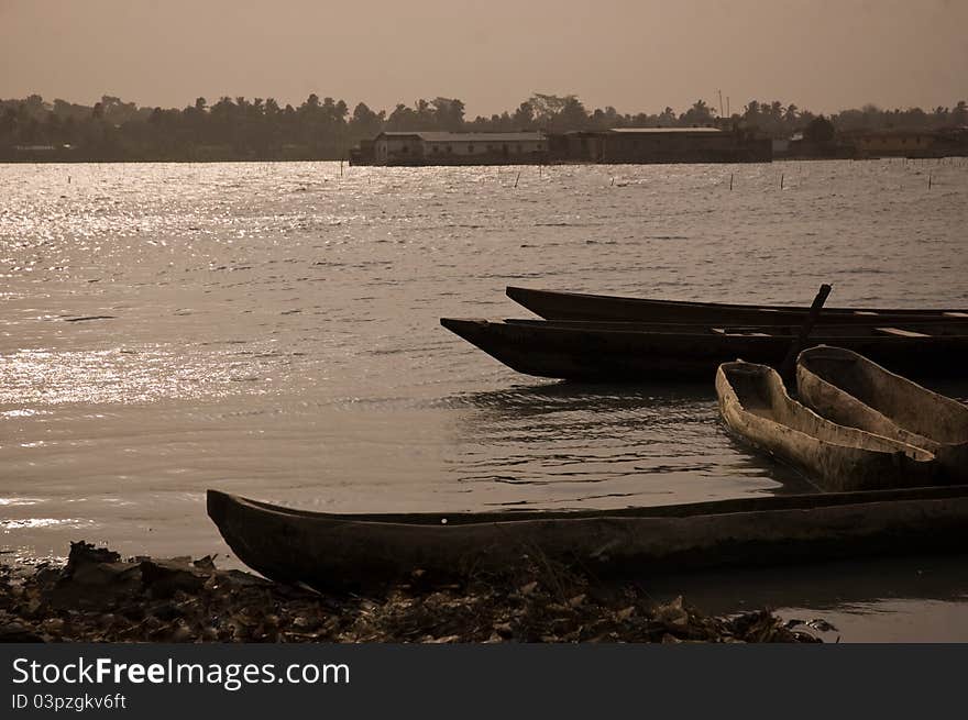 Empty wooden canoes in the Saint-Louis bay, Senegal, at the mouth of the Senegal river. Empty wooden canoes in the Saint-Louis bay, Senegal, at the mouth of the Senegal river