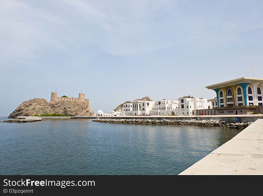 Wide angle shot of the elaborately decorated old palace of Sultan Qaboos bin Said al Said, with one of the twin forts of Jalali and Mirani that protects the entrance to the bay, visible to the left. In the middle is VIP accommodation for guests of the Sultan. Wide angle shot of the elaborately decorated old palace of Sultan Qaboos bin Said al Said, with one of the twin forts of Jalali and Mirani that protects the entrance to the bay, visible to the left. In the middle is VIP accommodation for guests of the Sultan.