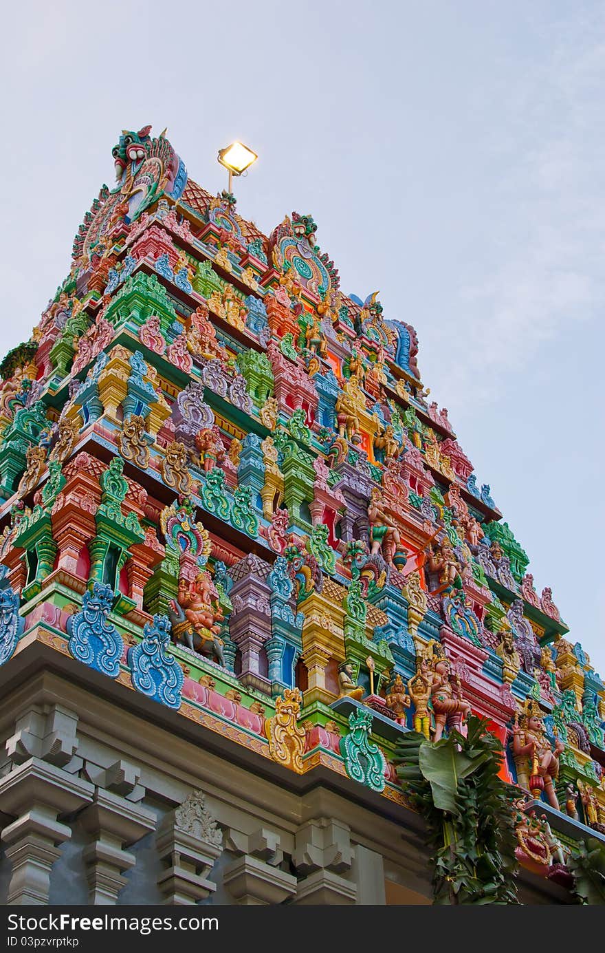 Generic Hindu temple with colorful and elaborate designs on the roof.