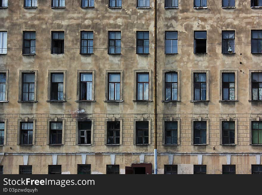 Windows of old block of flats in St. Petersburg