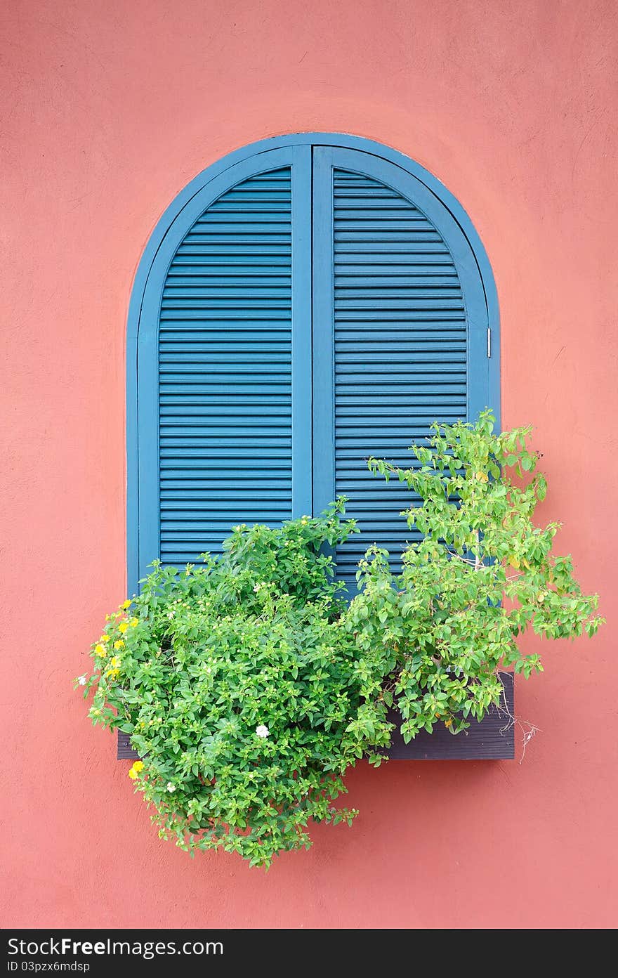 Classic blue window on red house. Classic blue window on red house