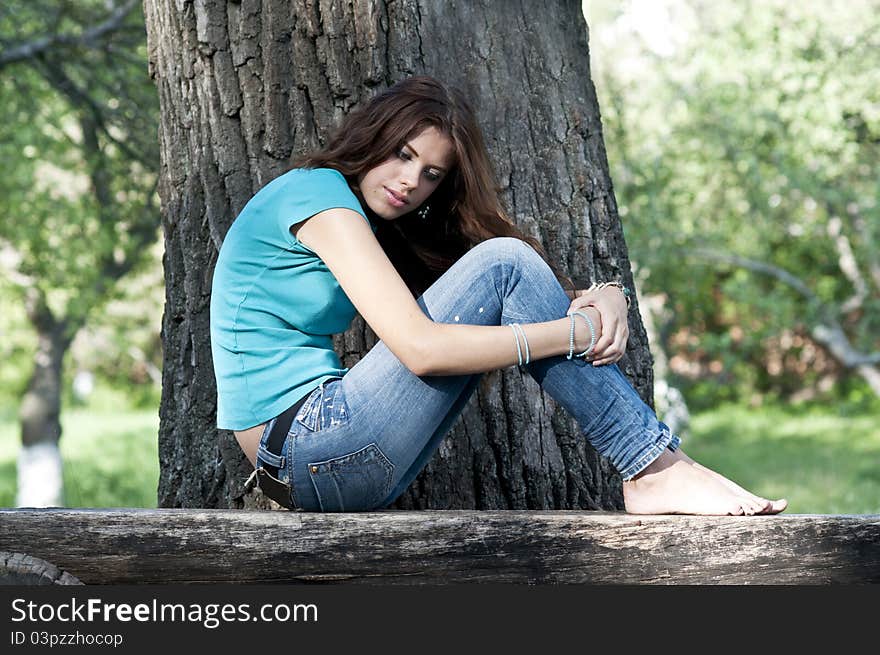 Beautiful Girl Sitting On A Bench