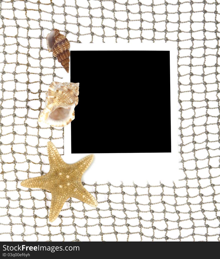 An old photo is on a background fishing net with cockleshells. An old photo is on a background fishing net with cockleshells