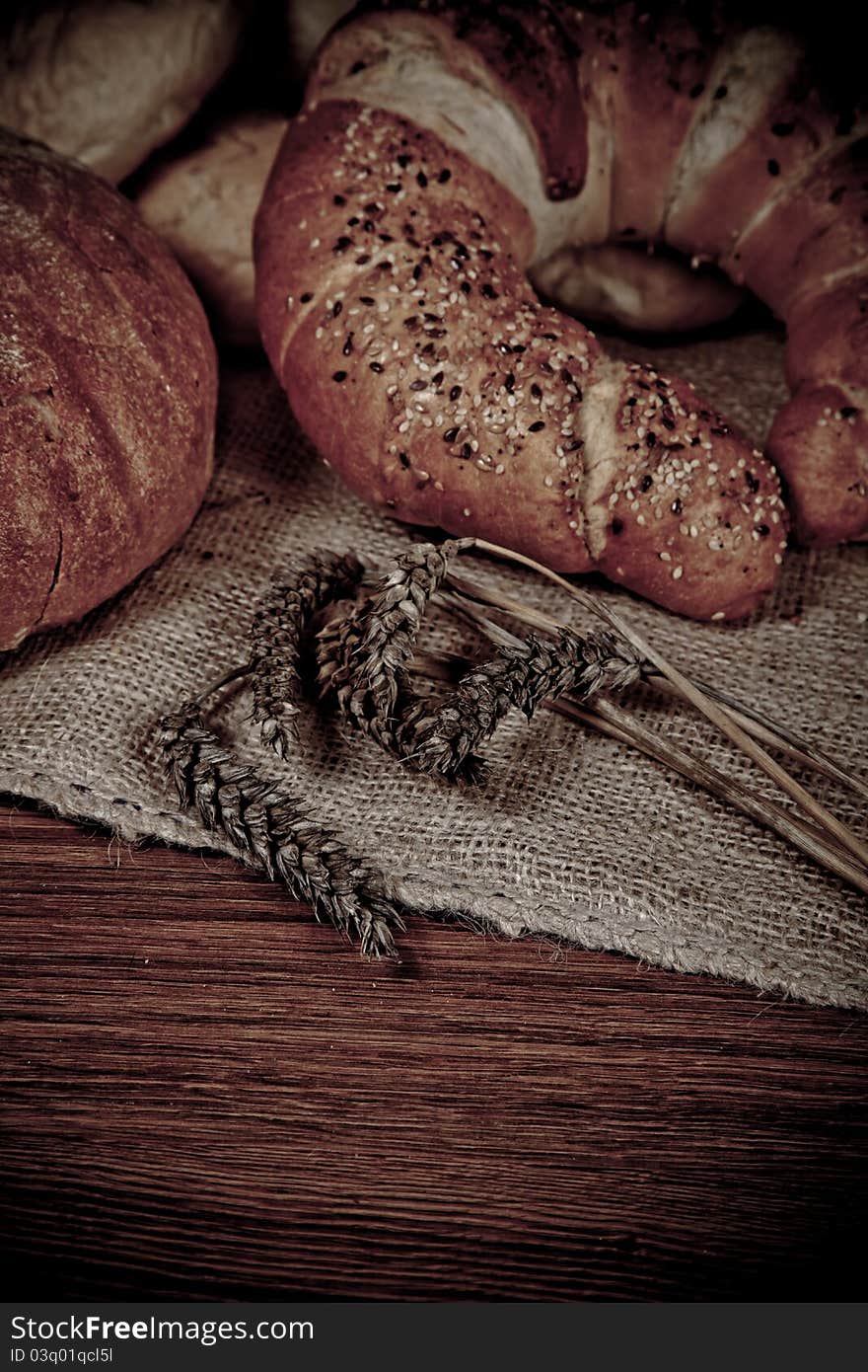 Composition of fresh bread on wood