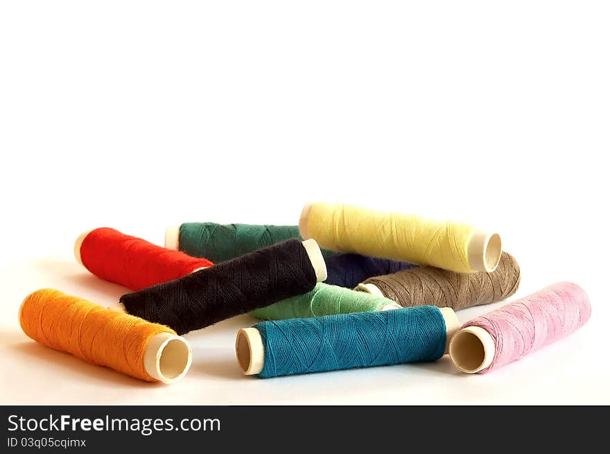 Several variously coloured thread on pile. Several variously coloured thread on pile.