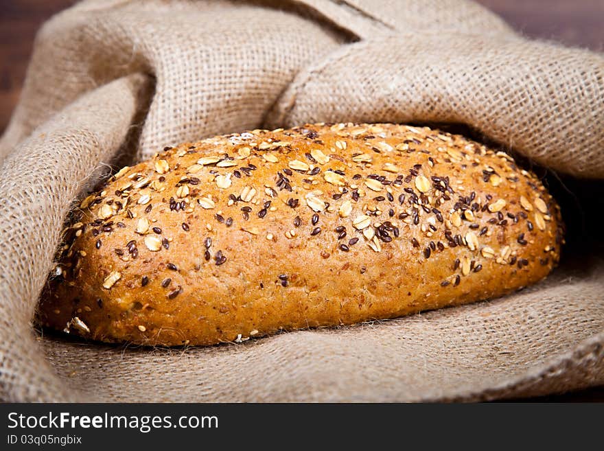 Composition of fresh bread on wooden background