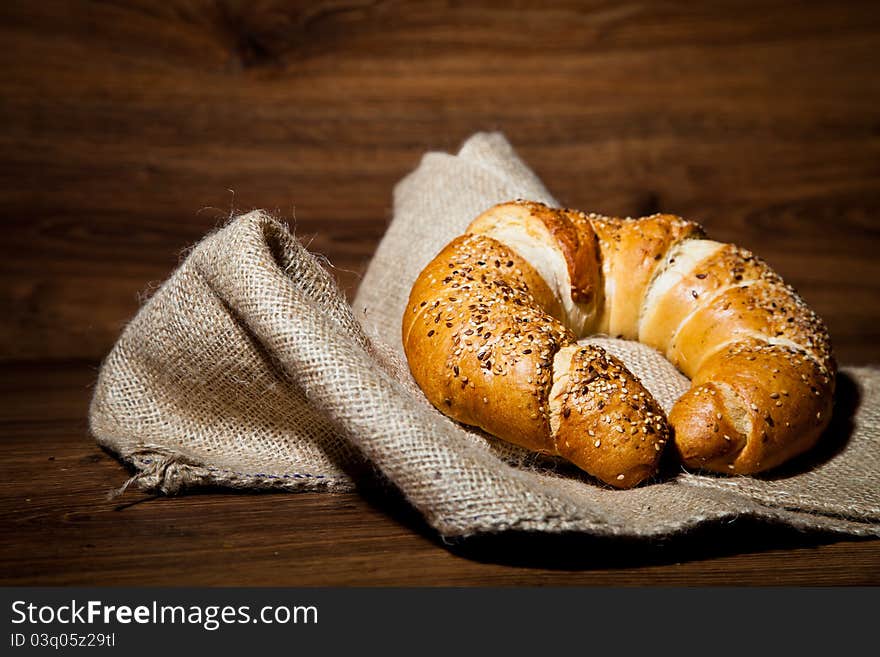 Composition of fresh bread on wooden background