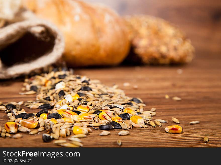 Composition of fresh bread on wooden background