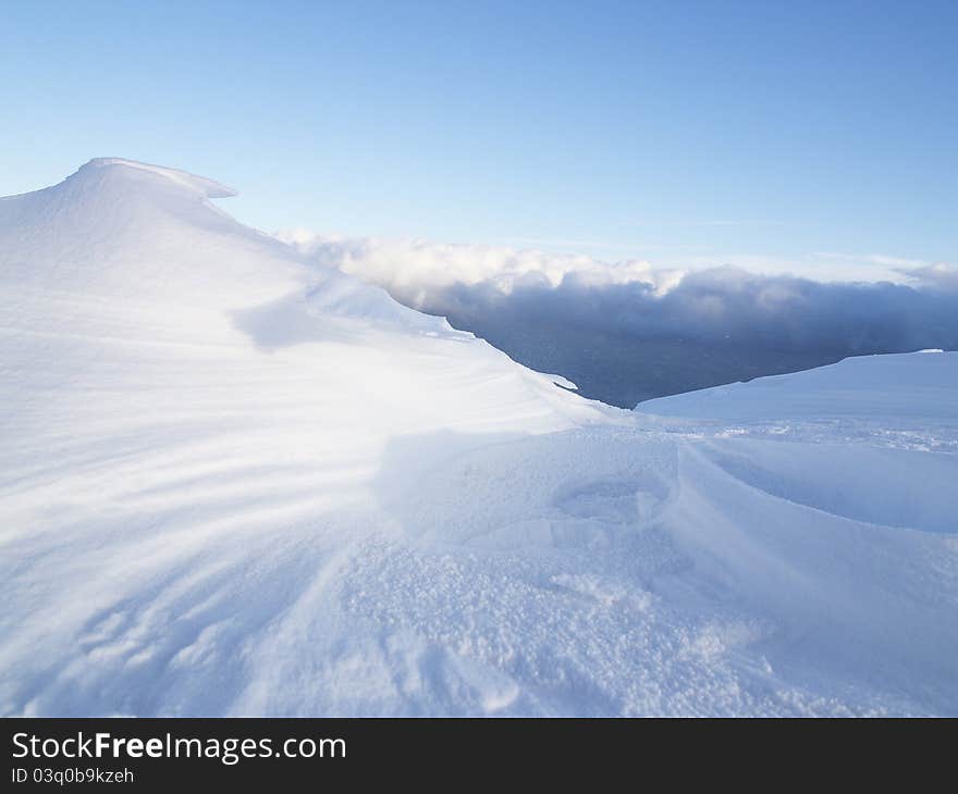 Snow creation over the clouds