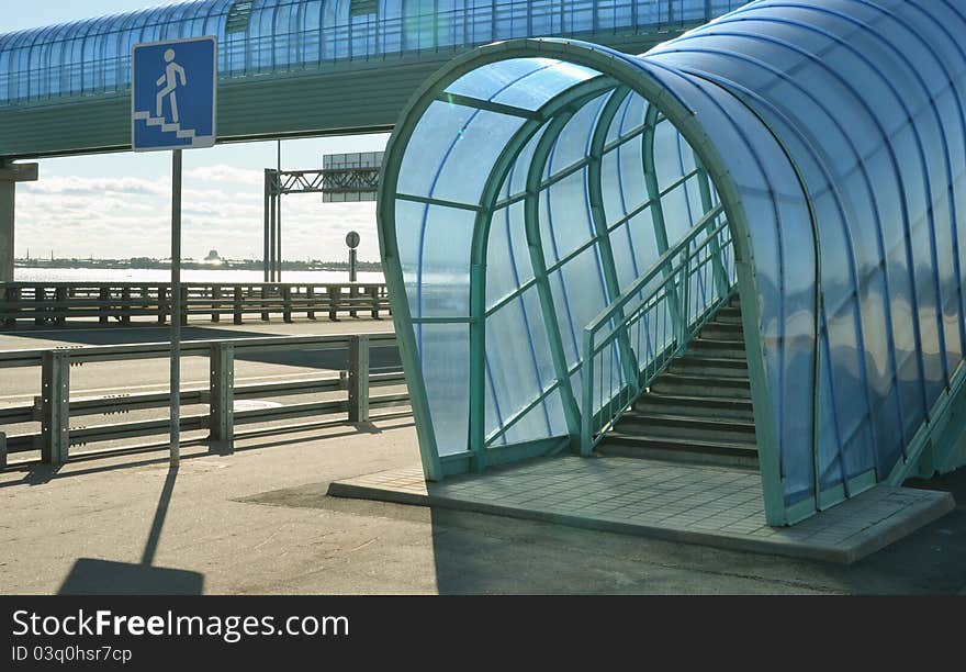 About a dark blue elevated pedestrian crossing