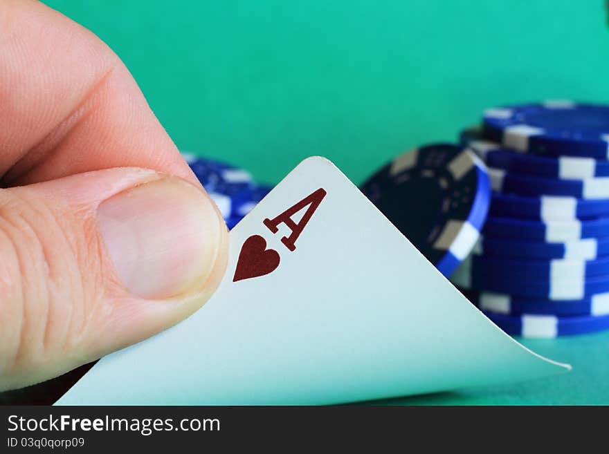 Card player reveals the Ace of Hearts