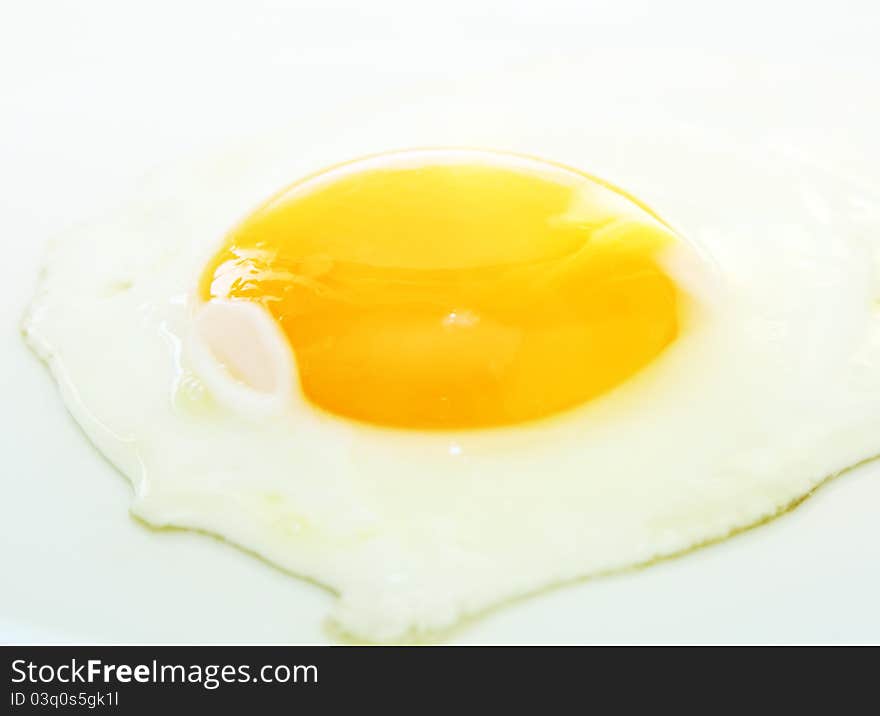 Image of fried egg on white