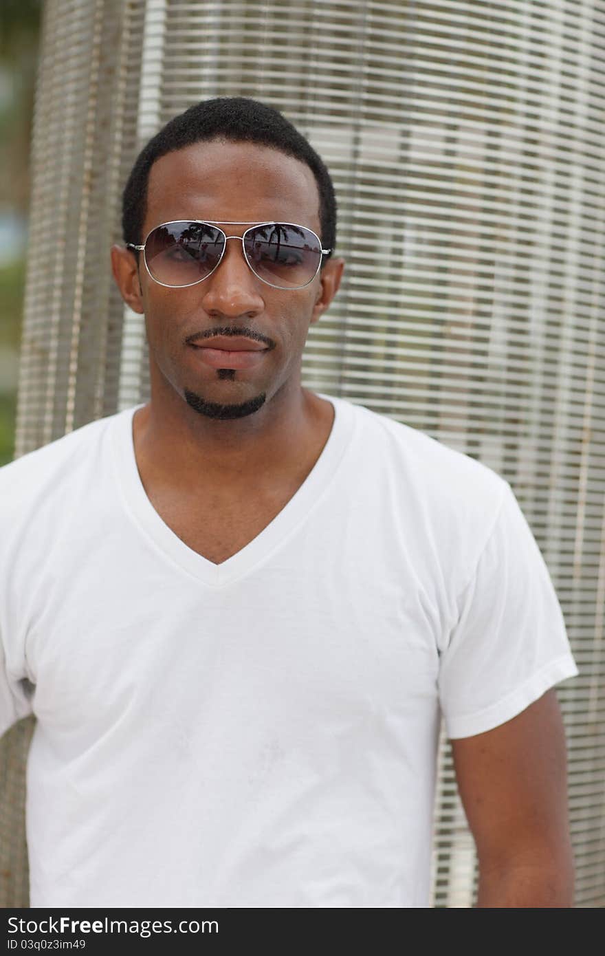 Image of a young black man with cool cunglasses. Image of a young black man with cool cunglasses