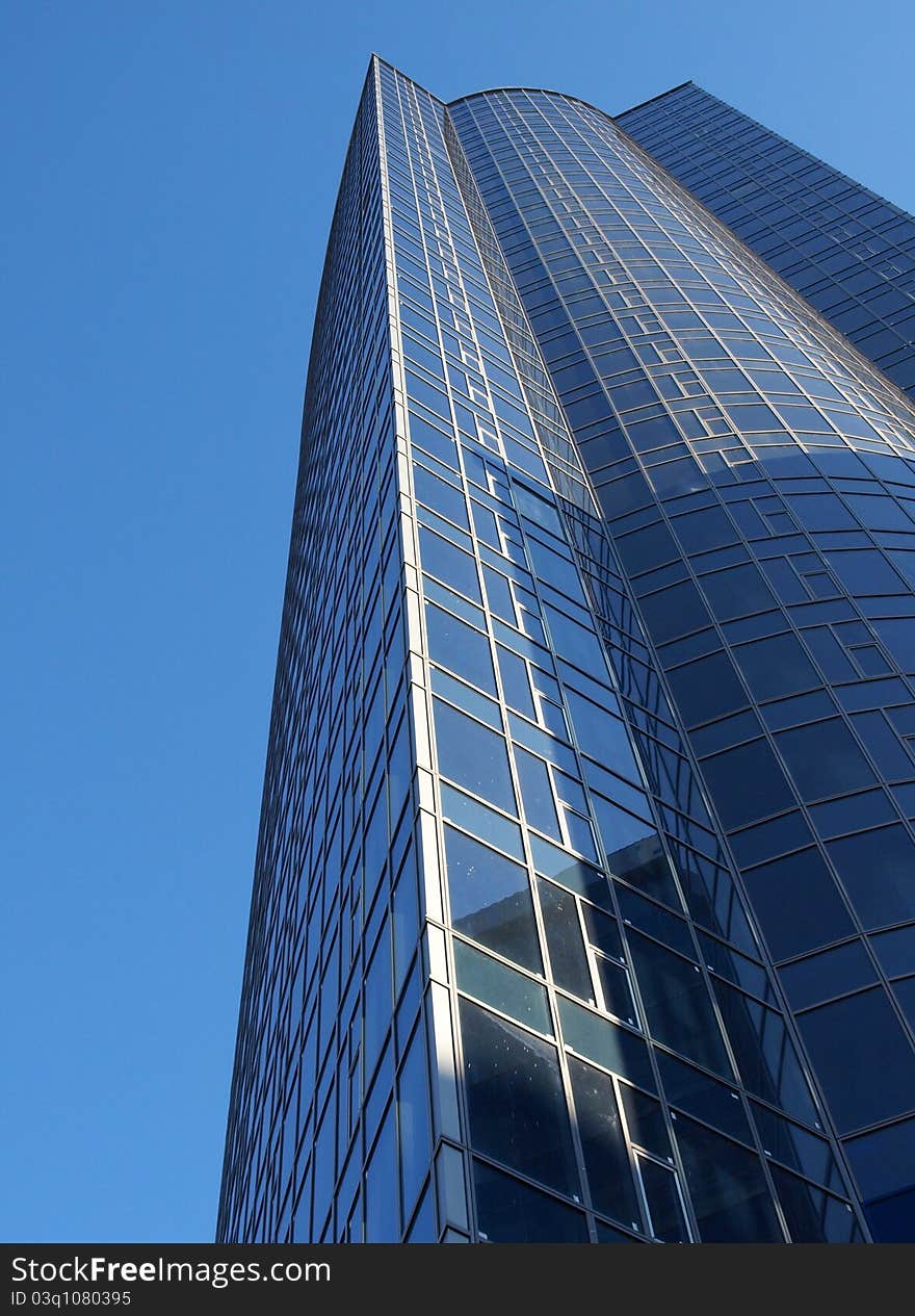 Office building, the facade against the evening sky. Office building, the facade against the evening sky